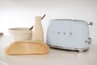 Smeg TSF01PBEU kenyérpirító (2 szeletes, 6 fokozat, melegítő, kiolvasztó, bagel funkció, morzsatálca, 950W, pasztellkék)