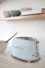 Smeg TSF01PBEU kenyérpirító (2 szeletes, 6 fokozat, melegítő, kiolvasztó, bagel funkció, morzsatálca, 950W, pasztellkék)