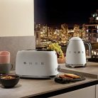 Smeg TSF01WHMEU kenyérpirító (2 szeletes, 6 fokozat, melegítő, kiolvasztó, bagel funkció, morzsatálca, 950W, matt fehér)
